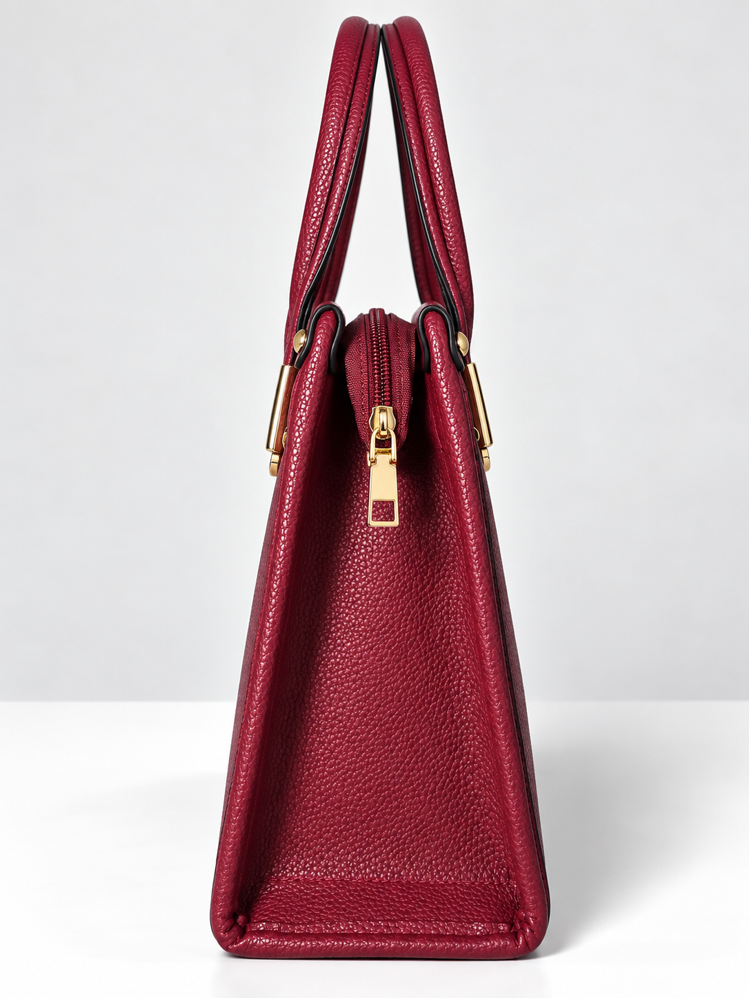 Bolso de mano rojo para mujer vista lateral con cierre de cremallera