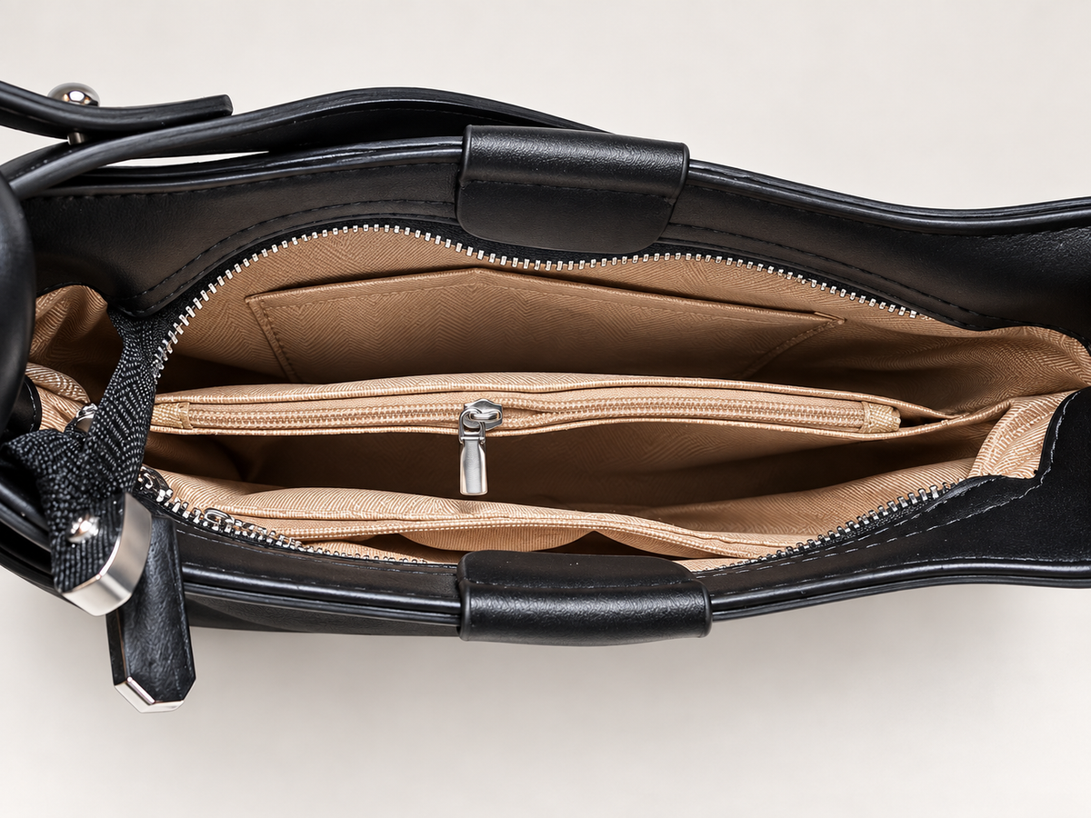 Bolso de hombro negro para mujer – detalle de compartimentos interiores