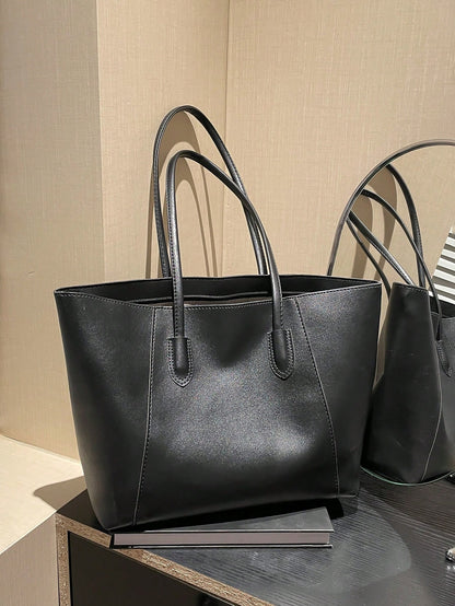 Bolso tote negro para mujer vista frontal con asas largas