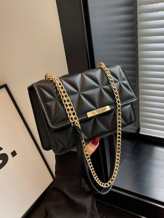 bolso negro acolchado con cadena dorada para dama