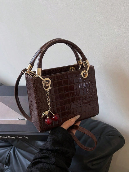 bolso café croco para dama con herrajes dorados