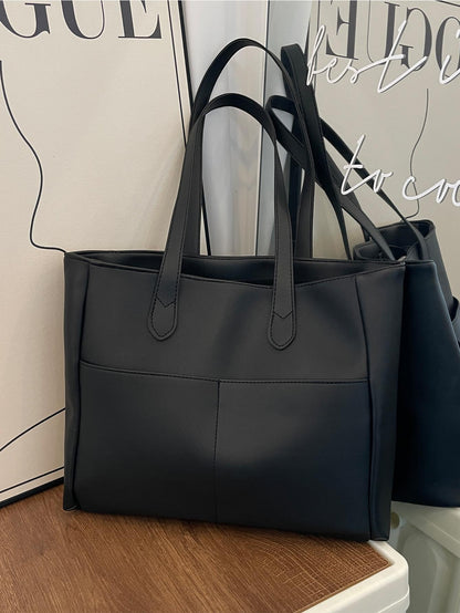 Bolso tote negro para mujer vista frontal con bolsillos exteriores