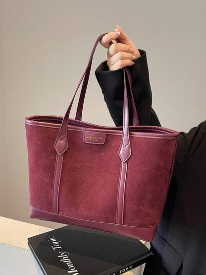Bolso tote burdeos para mujer vista frontal con acabado tipo ante