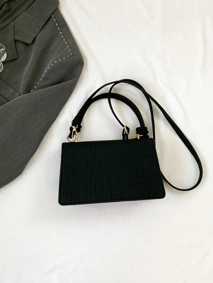 bolso negro con asa anudada elegante para mujer