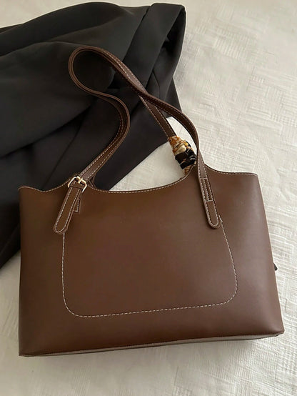 vista posterior del bolso marrón tote con doble asa