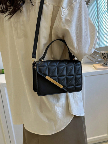bolso negro cruzado para mujer con detalle dorado