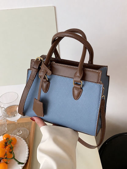 Bolso de mano azul para mujer con detalles café y doble asa
